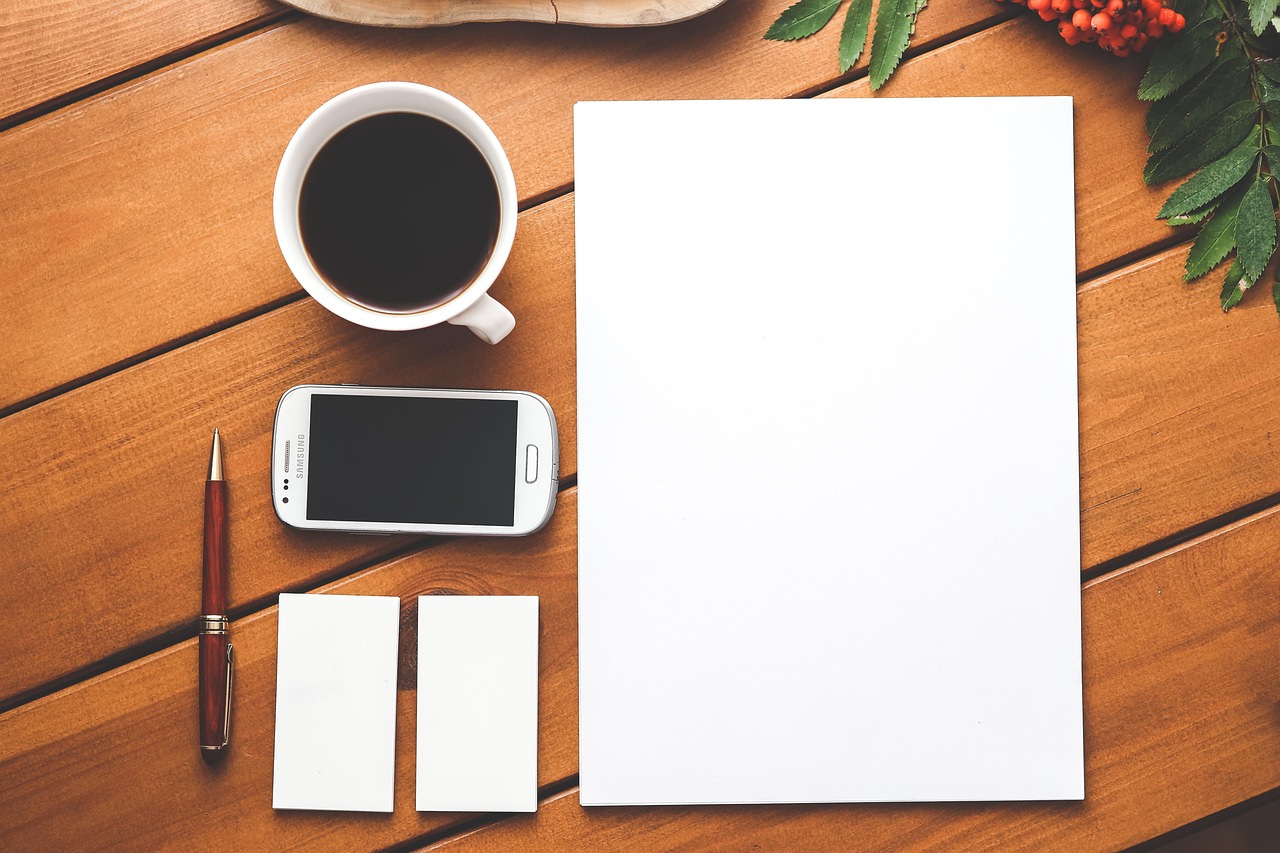 Desk with notes and phone—symbolizing focused study blocks rather than trading screens